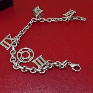 Authentic Tiffany & Co. Sterling Silver Atlas Roman Numeral Charm Bracelet